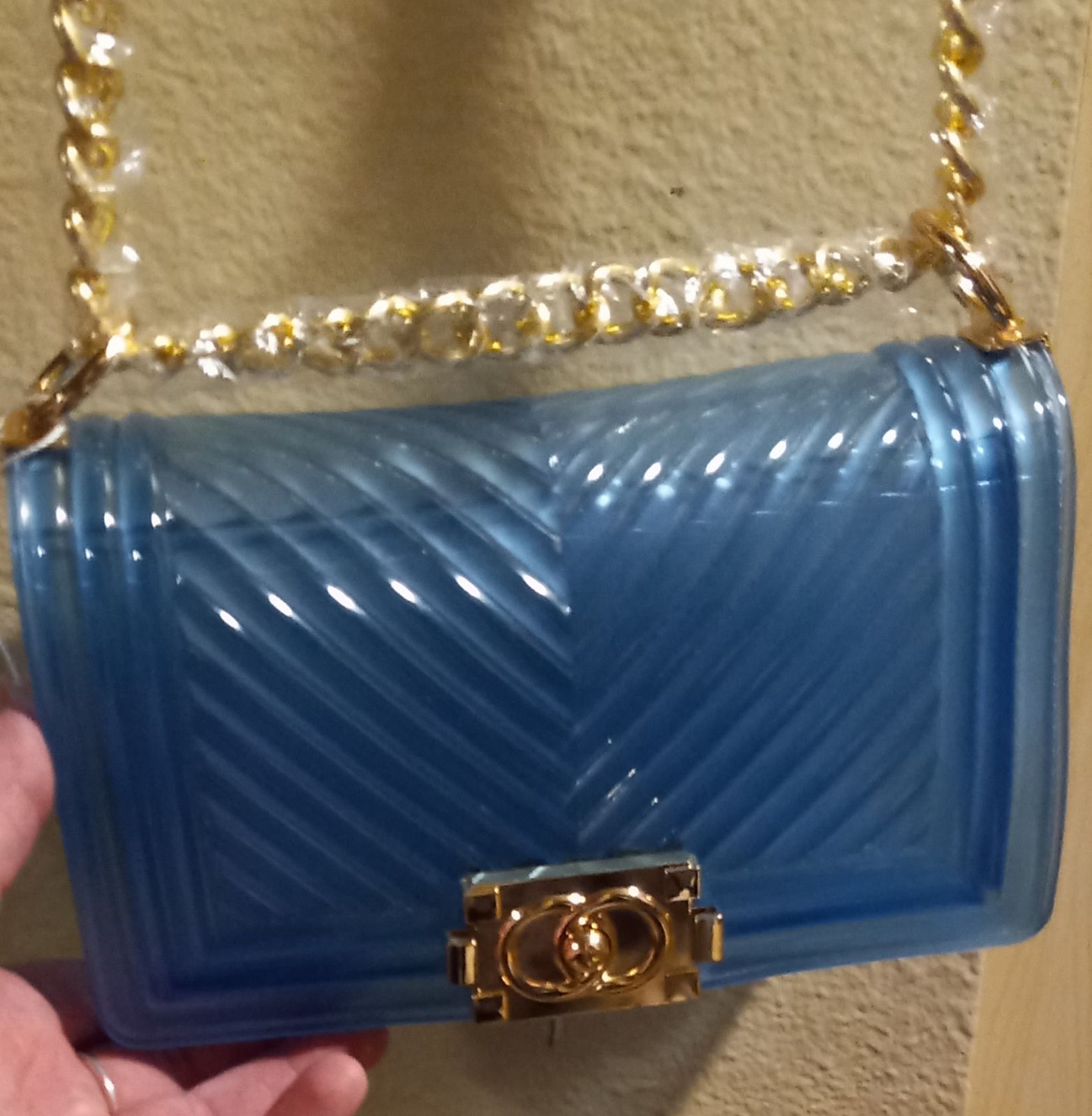 Blue plastic crossbody purse
